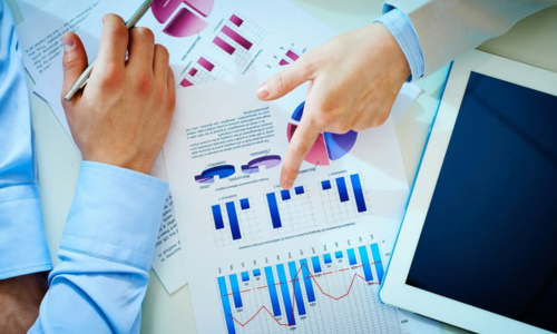 financial consultants reviewing financial statements for strategic planning